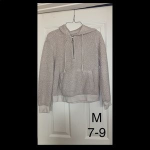 Youth medium (7-9) quarter zip sweatshirt. Fuzzy, white. Has a hood.